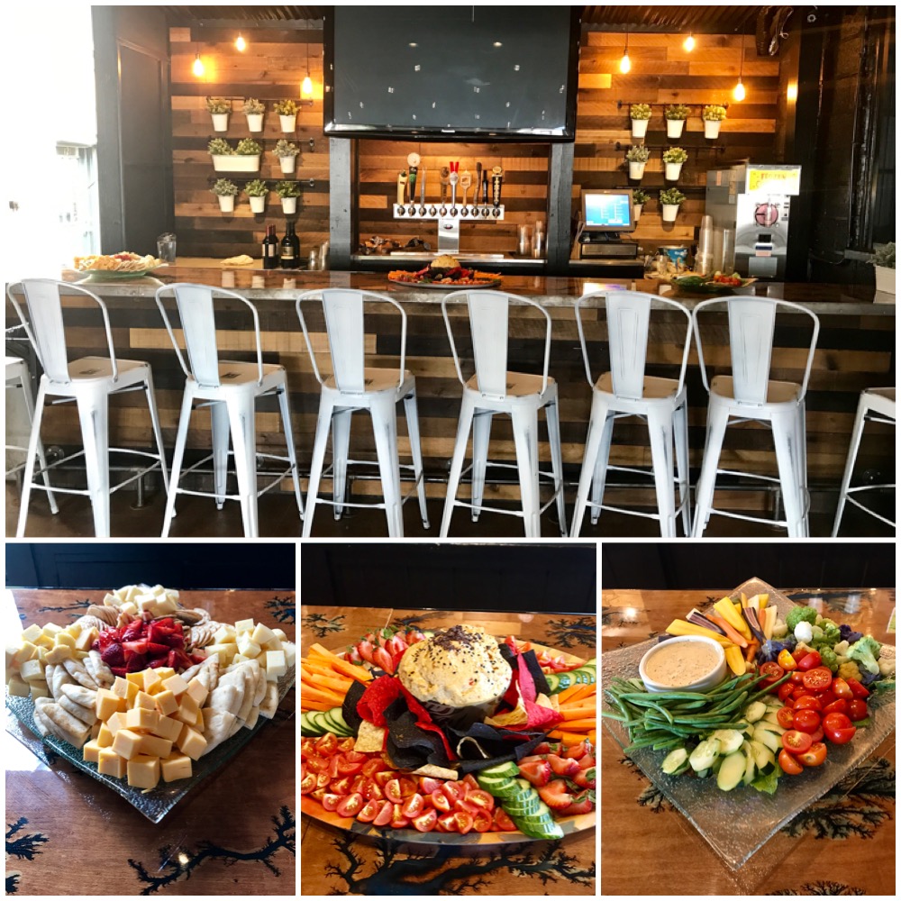 A variety of appetizers are displayed at a bar.