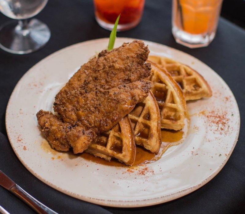 Fried chicken and waffles on a plate.